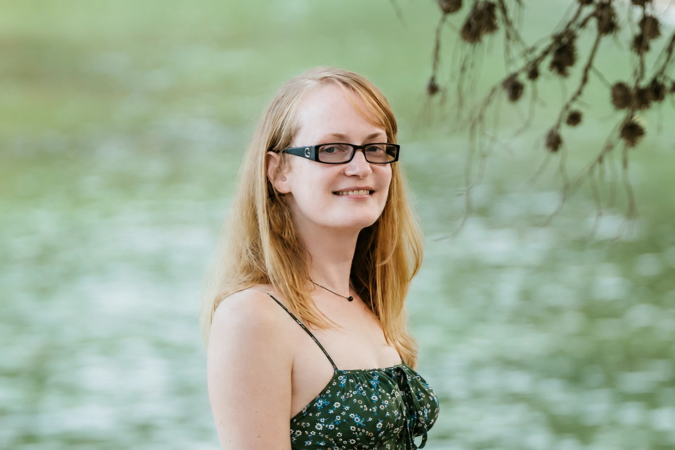 Svitlana Lukicheva outdoors by a lake